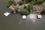 DRONE VIEW OF THE HOUSE & DOCK WITH THE KAYAKS IN USE